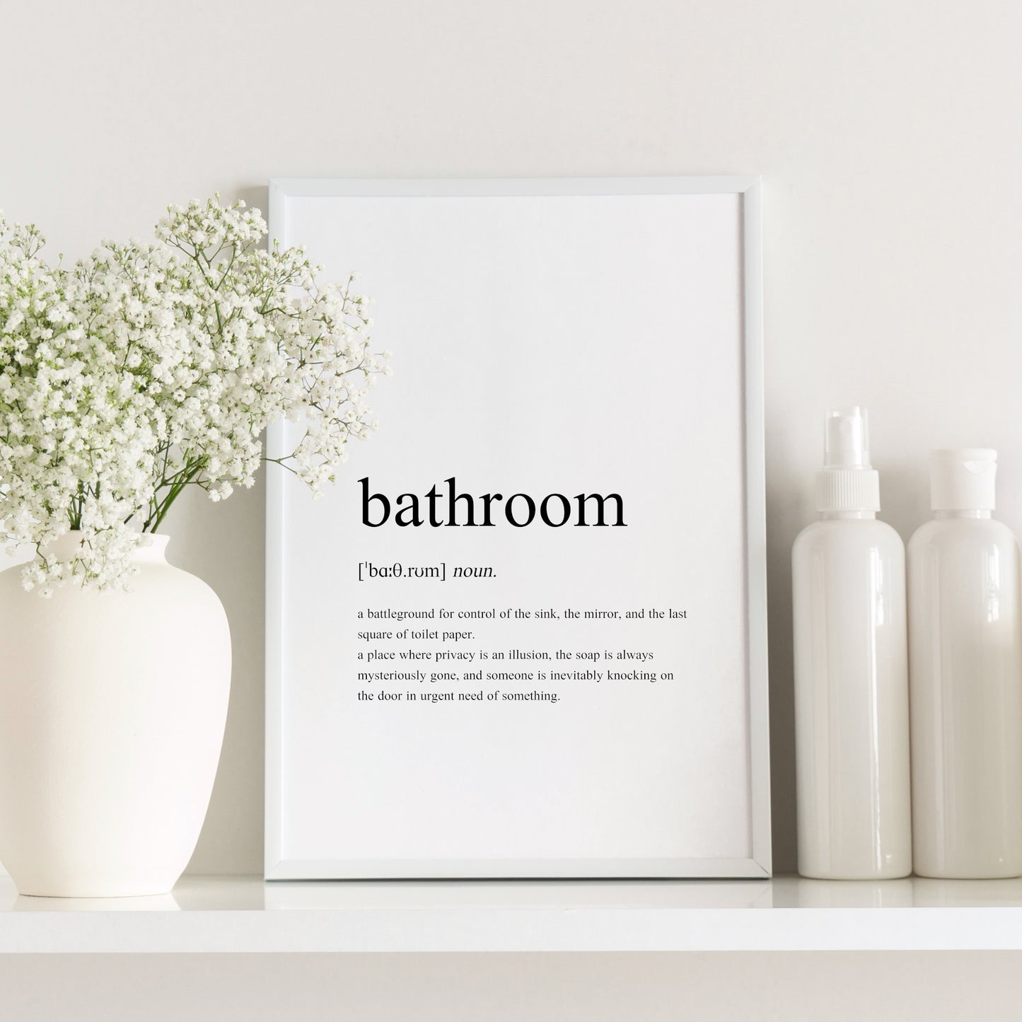 Single portrait typography print featuring a dictionary-style definition of the word bathroom. The word itself, together with its phonetic pronunciation, type and definition are included. Text is in a lower case serif font, black on a white background and left-aligned.