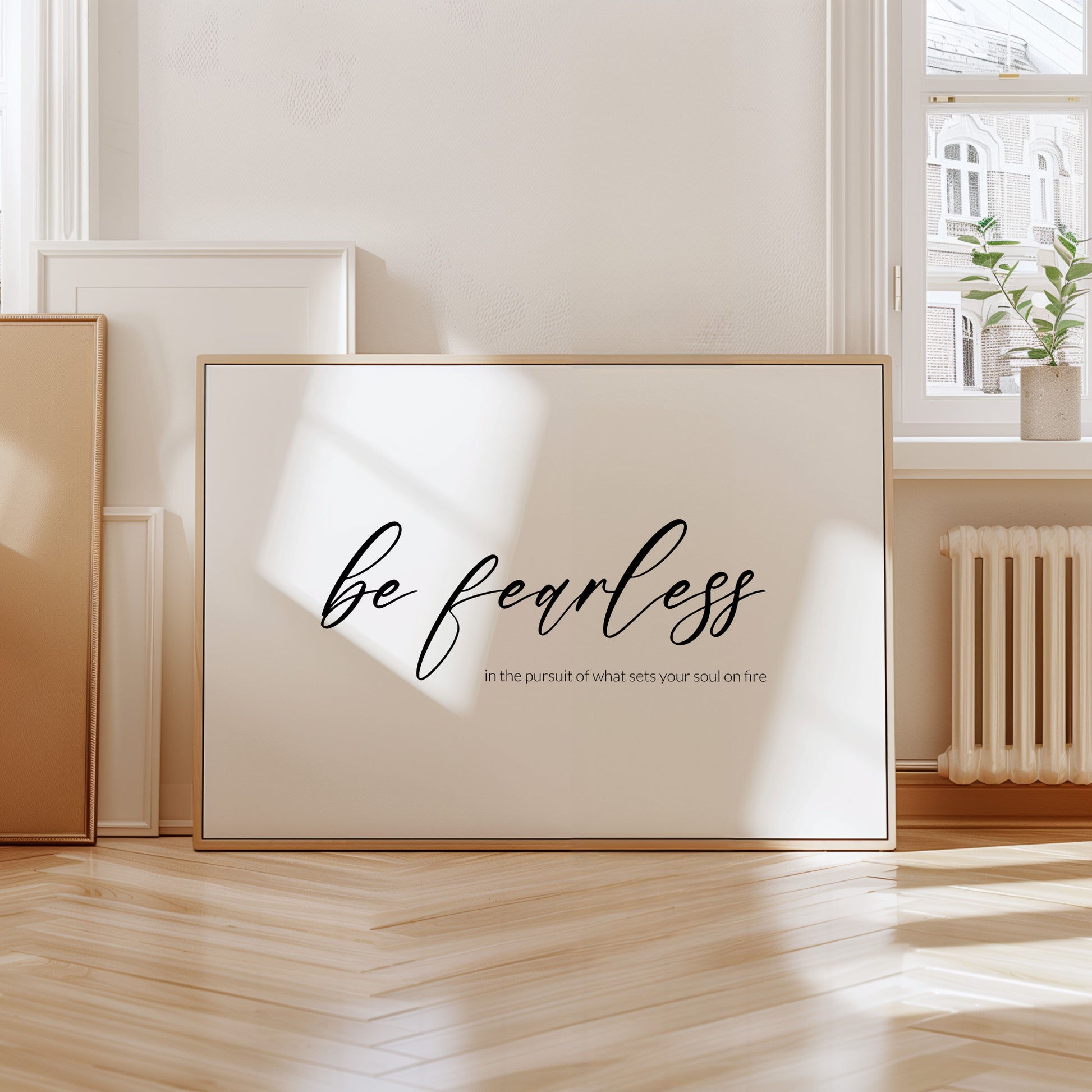 Single landscape typography print. Text reads: Be fearless in the pursuit of what sets your soul on fire. The words "be fearless" are positioned prominently in a modern script font and are centred vertically and horizontally. Remaining text in a lightweight sans serif font aligned to the bottom right of the "be fearless" text. All text is lower case, black on a white background. Styling is contemporary and elegant.