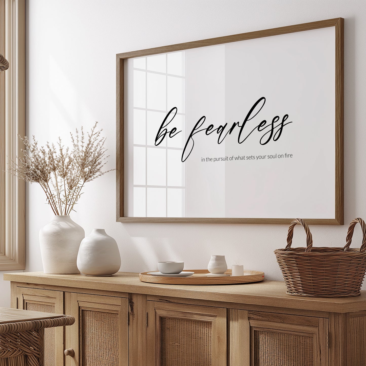 Single landscape typography print. Text reads: Be fearless in the pursuit of what sets your soul on fire. The words "be fearless" are positioned prominently in a modern script font and are centred vertically and horizontally. Remaining text in a lightweight sans serif font aligned to the bottom right of the "be fearless" text. All text is lower case, black on a white background. Styling is contemporary and elegant.