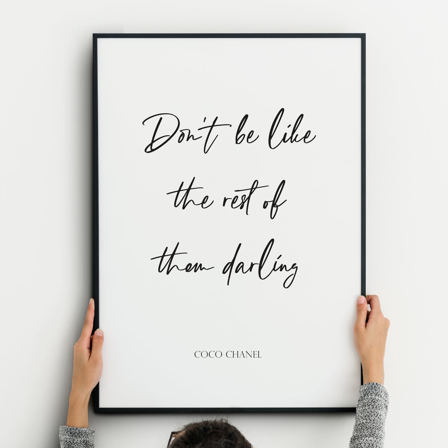 Single portrait typography print. Text reads: Don't be like the rest of them darling - Coco Chanel. The quote is positioned prominently in a modern script font. The attribution below is in a formal upper case serif font. All text is black on a white background and centre-aligned.