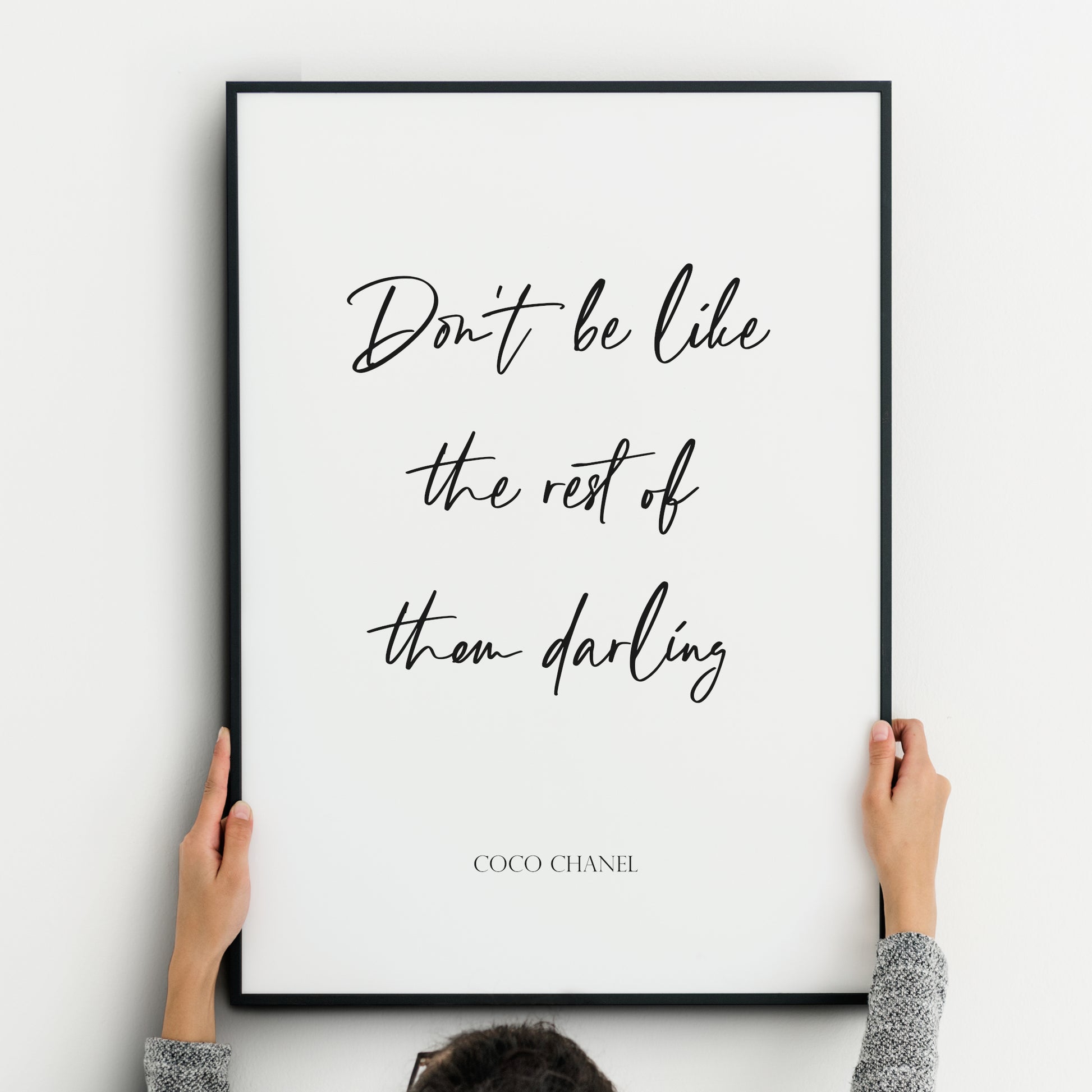 Single portrait typography print. Text reads: Don't be like the rest of them darling - Coco Chanel. The quote is positioned prominently in a modern script font. The attribution below is in a formal upper case serif font. All text is black on a white background and centre-aligned.