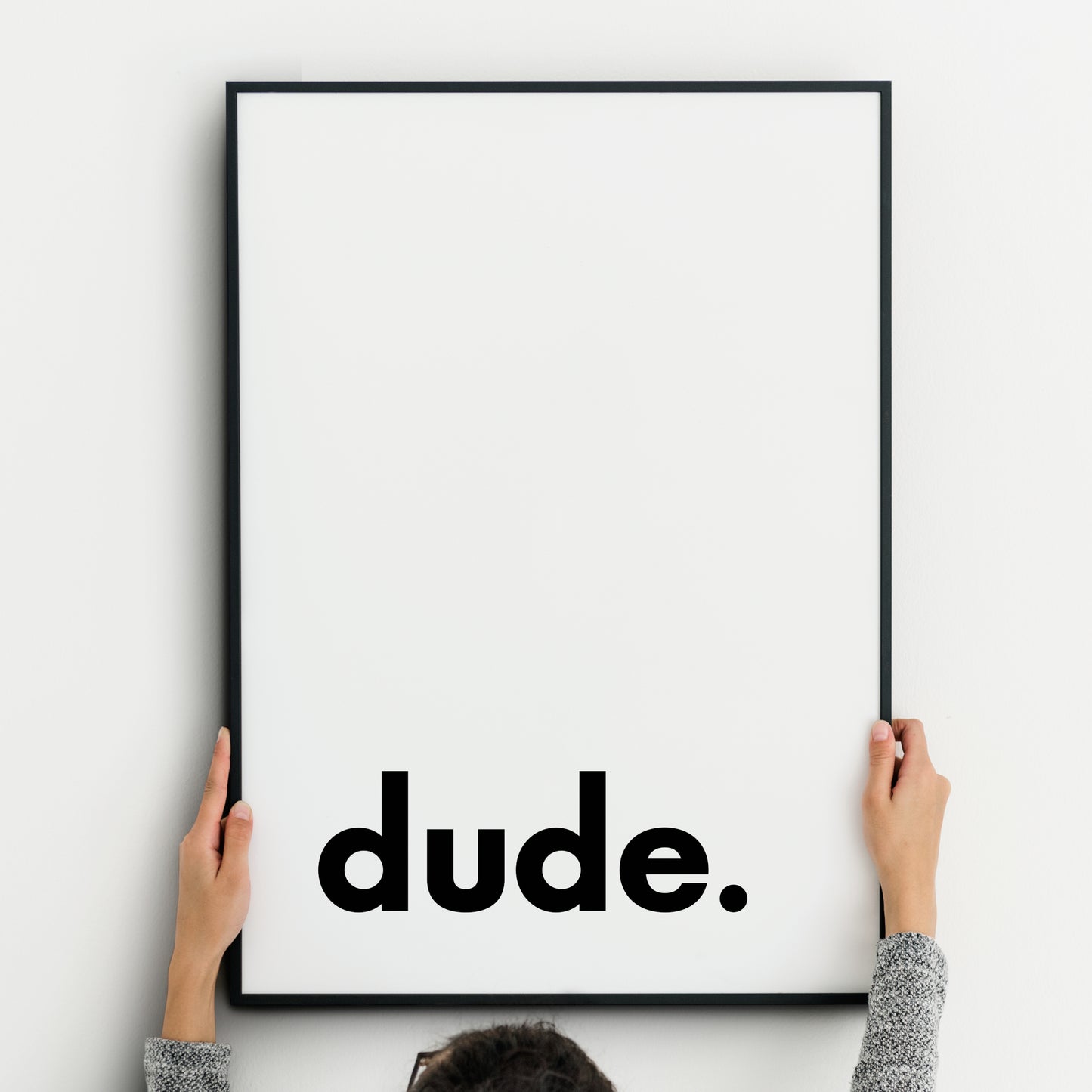 Single portrait typography print. Text reads "dude.", in a bold lower case sans serif font, positioned to the bottom left. Text is black on a white background. Styling is modern and minimalist.