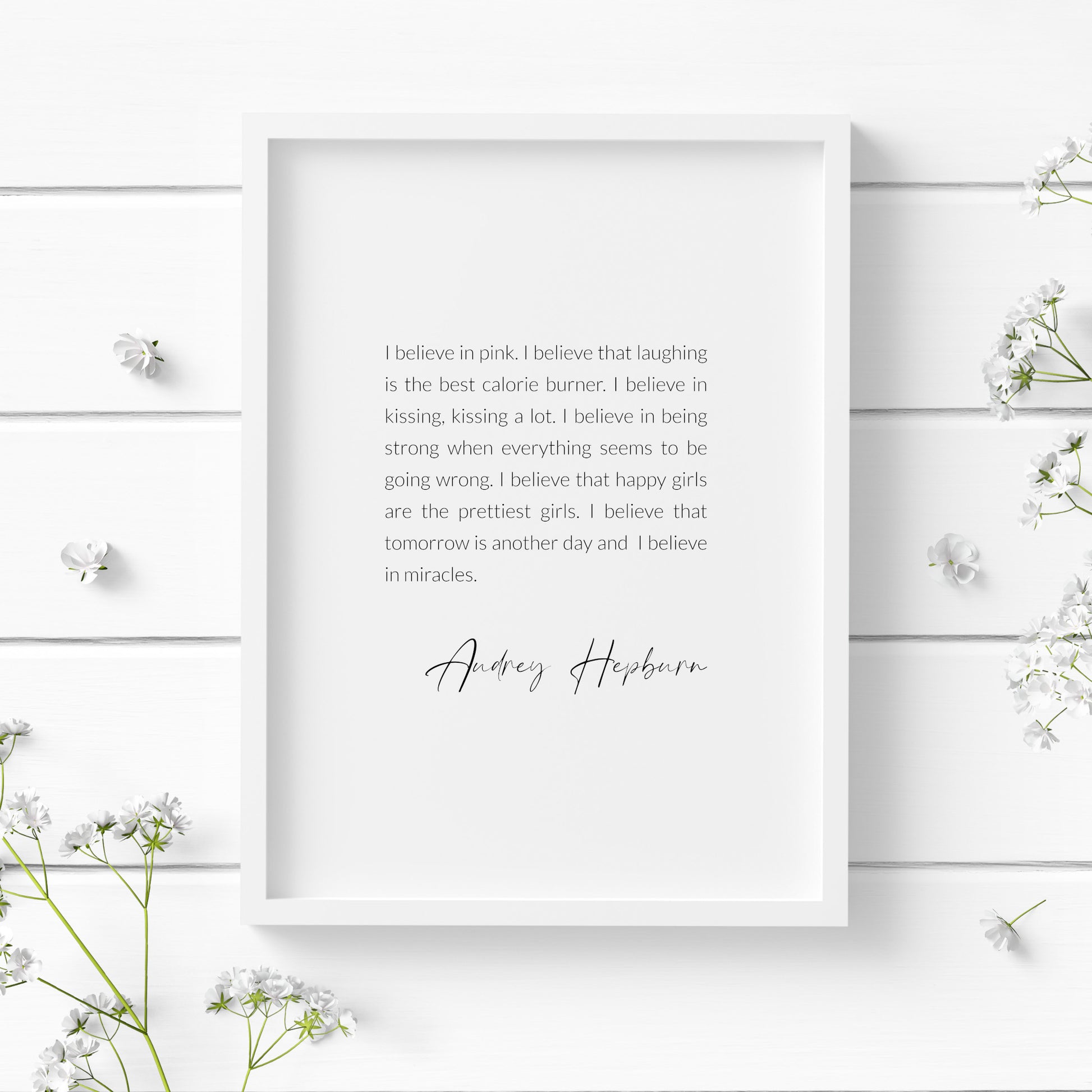 Single portrait typography print featuring an inspirational quote by Audrey Hepburn. Text is black on a white background, in a crisp sans serif font and fully justified. An attribution to Audrey Hepburn is positioned below in an elegant script font.