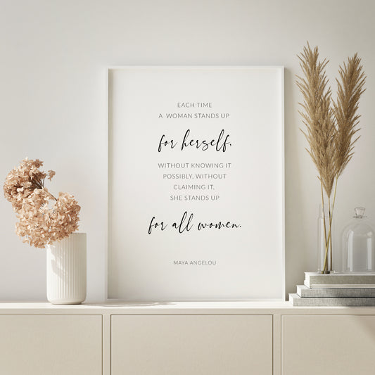 Single portrait typography print featuring a feminist quote from Maya Angelou. Text is in crisp sans serif font, with the exception of the words “for herself” and “for all women”, which are positioned more prominently in a modern script font. Text is black on a white background.