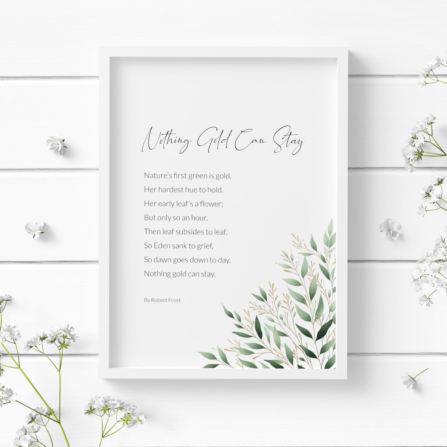 Single portrait print featuring the poem “Nothing Gold Can Stay” by Robert Frost. The title is in a modern script font, with the body copy and attribution in a lightweight sans serif font. Text is black on a white background and left aligned. The poem is complemented by a delicate illustration positioned to the bottom right, which shows a spray of foliage in shades of green and gold. Styling is elegant and contemporary.
