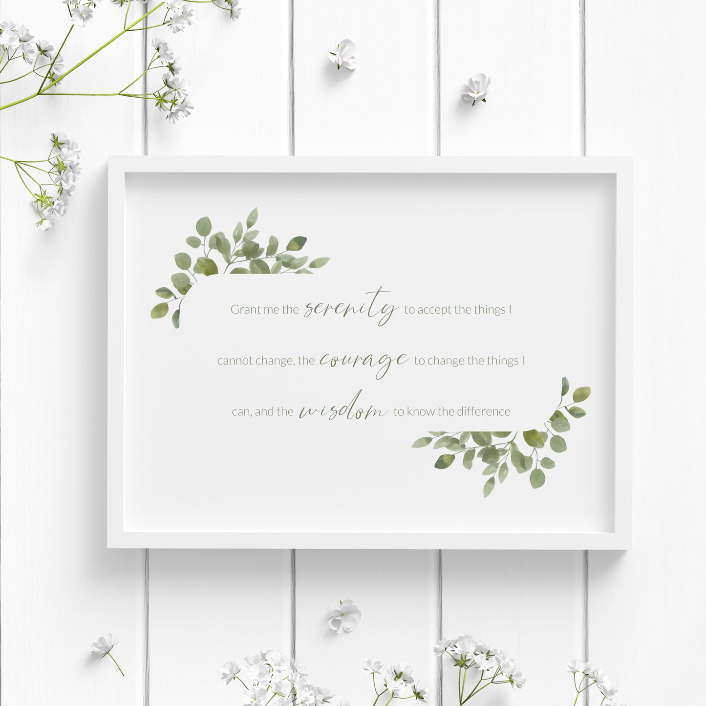 Single landscape print of the Serenity Prayer. Text reads: Grant me the serenity to accept the things I cannot change, the courage to change the things I can, and the wisdom to know the difference. Text is green and framed by eucalyptus leaves.