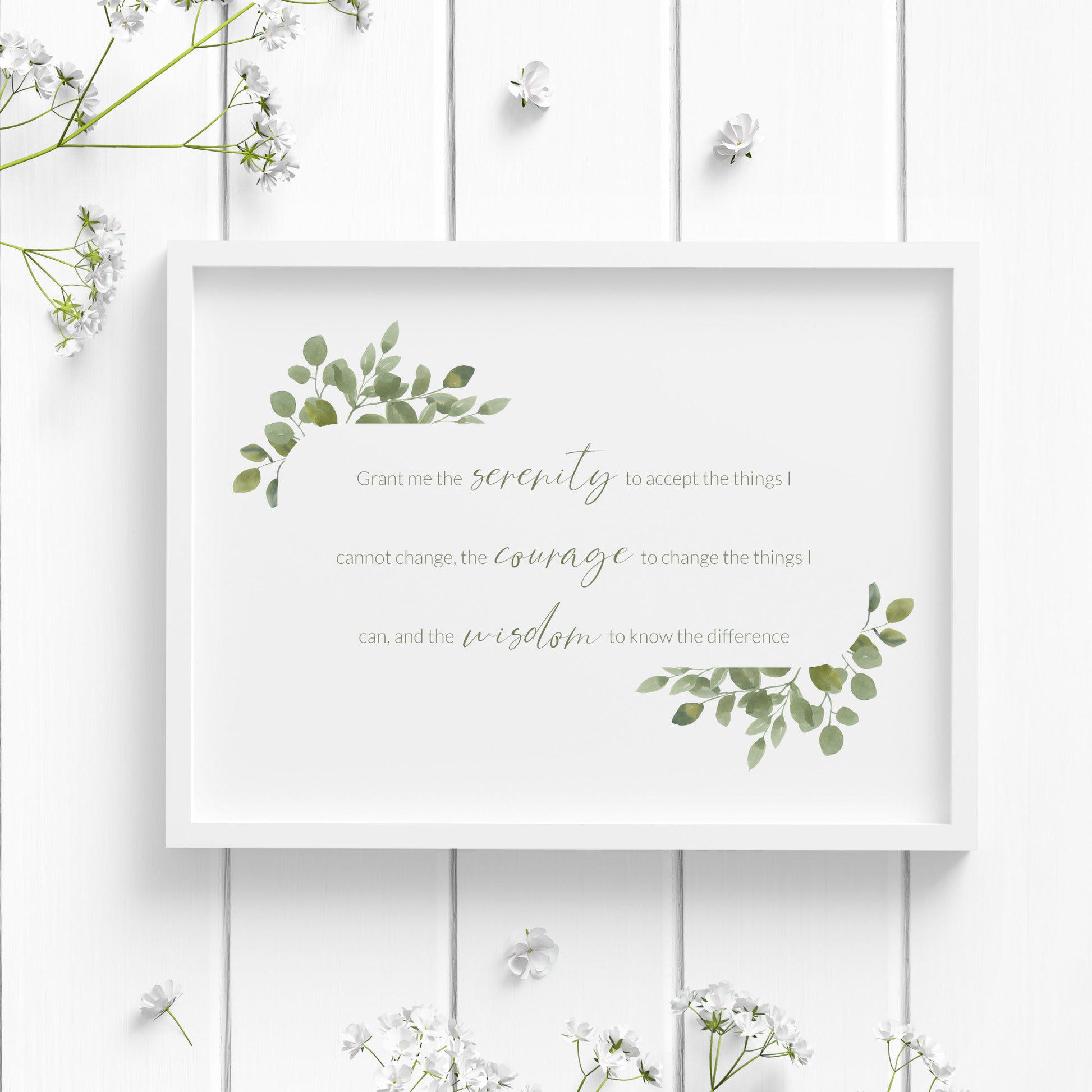 Single landscape print of the Serenity Prayer. Text reads: Grant me the serenity to accept the things I cannot change, the courage to change the things I can, and the wisdom to know the difference. Text is green and framed by eucalyptus leaves.
