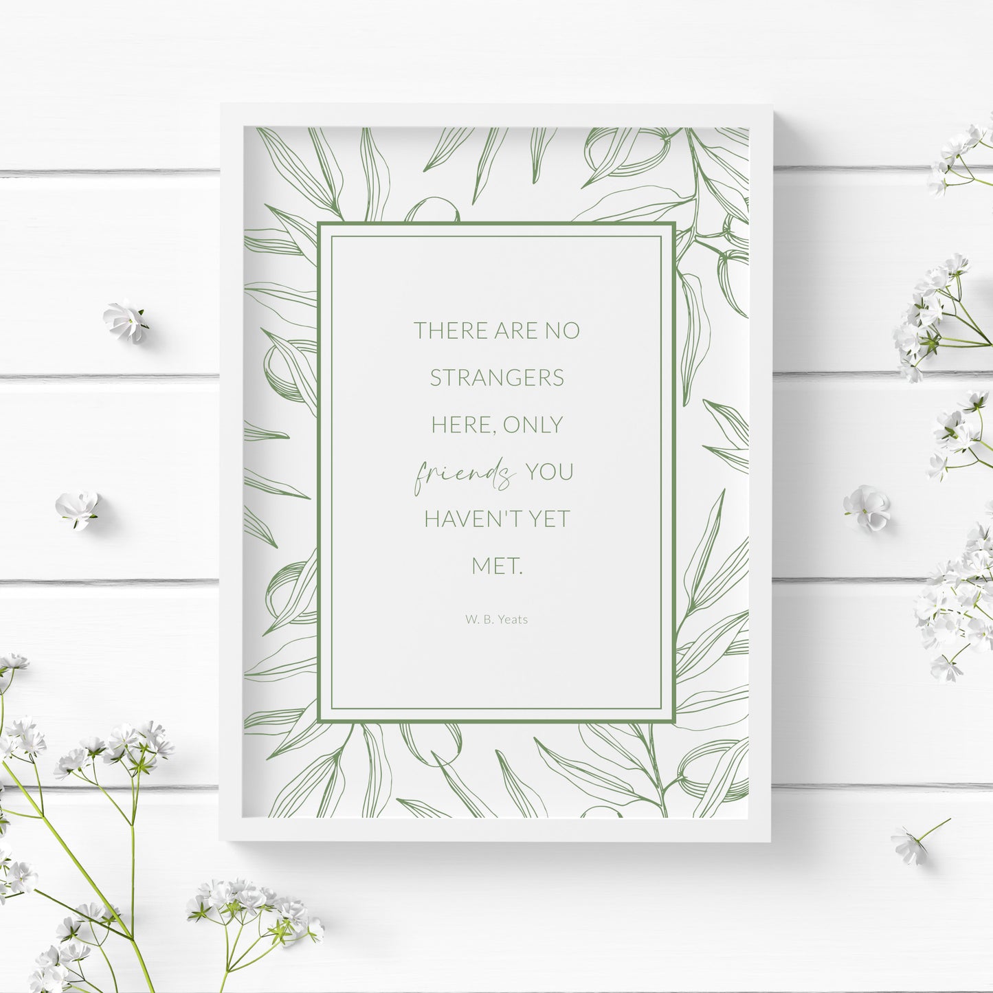 Single portrait print featuring the W. B. Yeats quote: There are no strangers here, only friends you haven't yet met. Text is centred in a rectangular frame, with an outer border of line art foliage. All text and imagery is in a dark sage green.