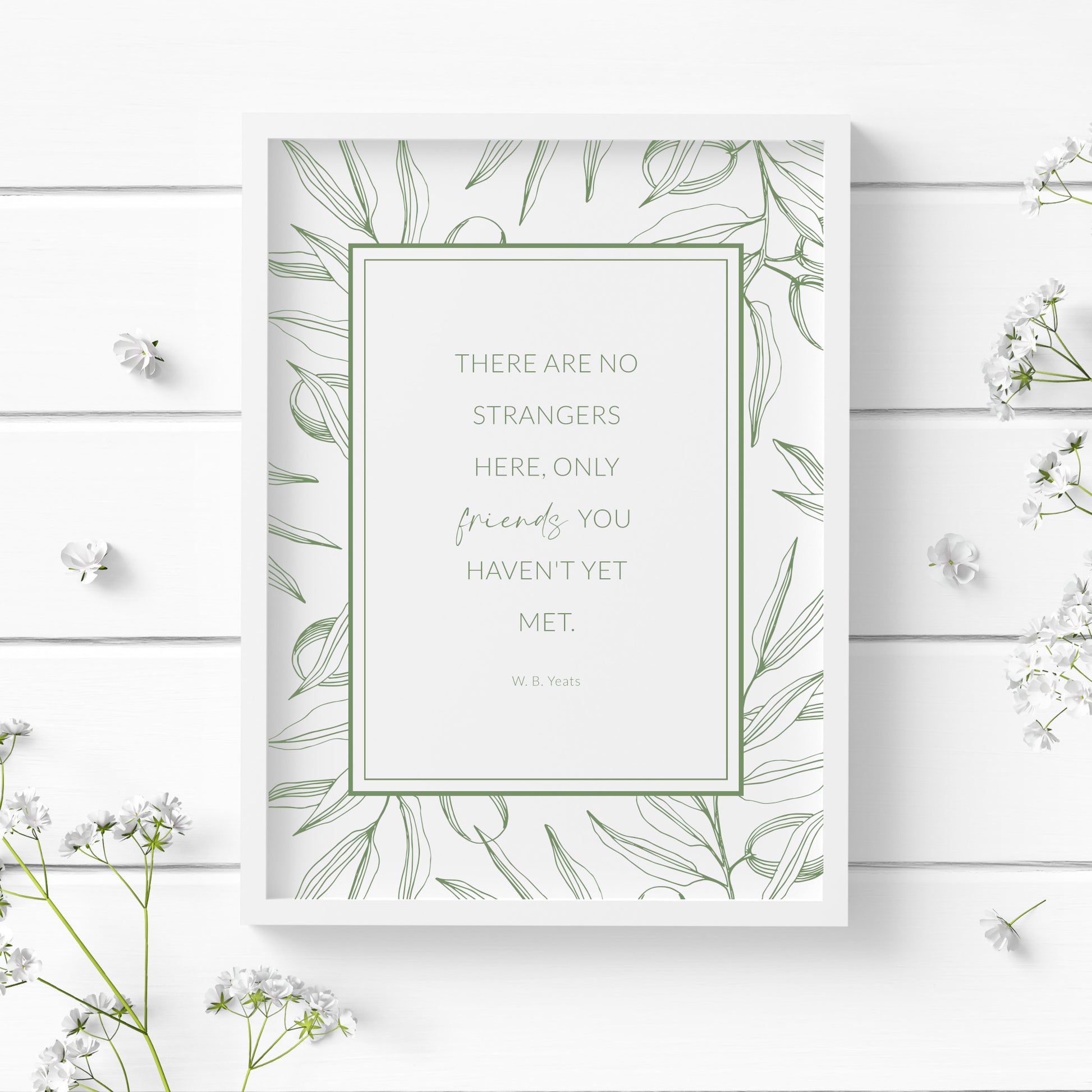 Single portrait print featuring the W. B. Yeats quote: There are no strangers here, only friends you haven't yet met. Text is centred in a rectangular frame, with an outer border of line art foliage. All text and imagery is in a dark sage green.
