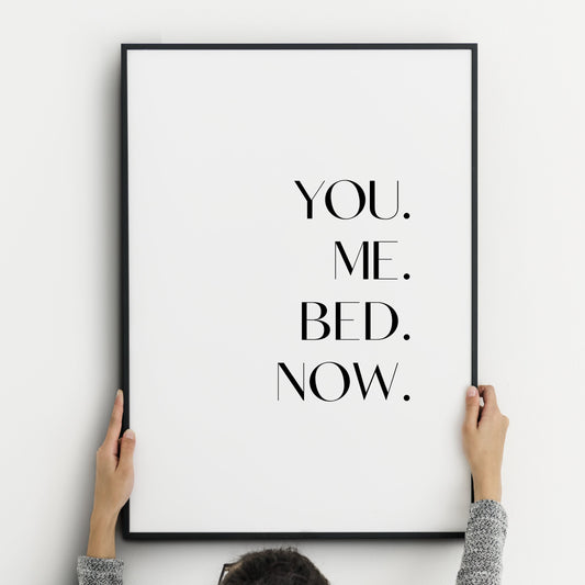 Single portrait typography print. Text reads "You. Me. Bed. Now.". The words are in a stylish upper case sans serif font and are stacked vertically and right aligned. Text is black on a white background.