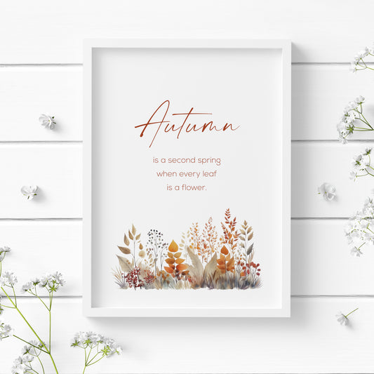 Single portrait print of Albert Camus quote: Autumn is a second spring when every leaf is a flower. The word Autumn is prominent in a modern script font. Other text is in a small, sans serif font. An illustration of autumn foliage is below the text.