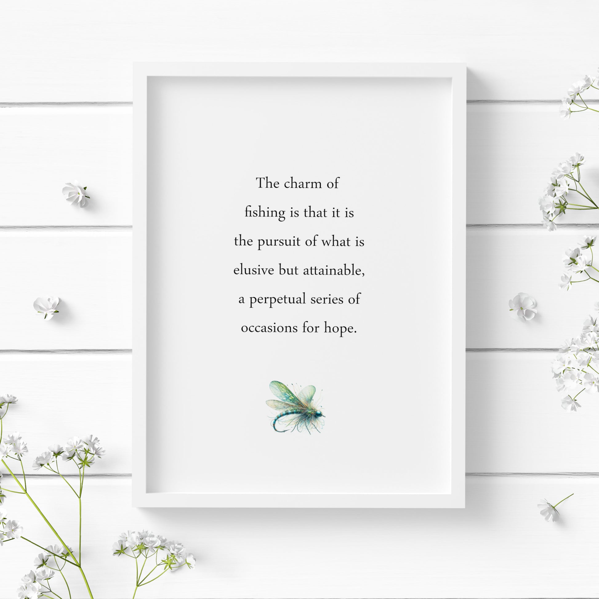Single portrait typography print featuring a John Buchan quote about the charm of fishing. Text is black on a white background and in classic sentence case serif font. A delicate illustration of a fishing lure is positioned below in blues and greens.
