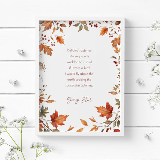 Single illustrated typography print featuring seasonal quote from George Eliot beginning "Delicious Autumn". Warm terracotta typography is surrounded by a watercolour border of orange, rust and green autumn leaves, berries, acorns and foliage. Styling is elegant and contemporary.