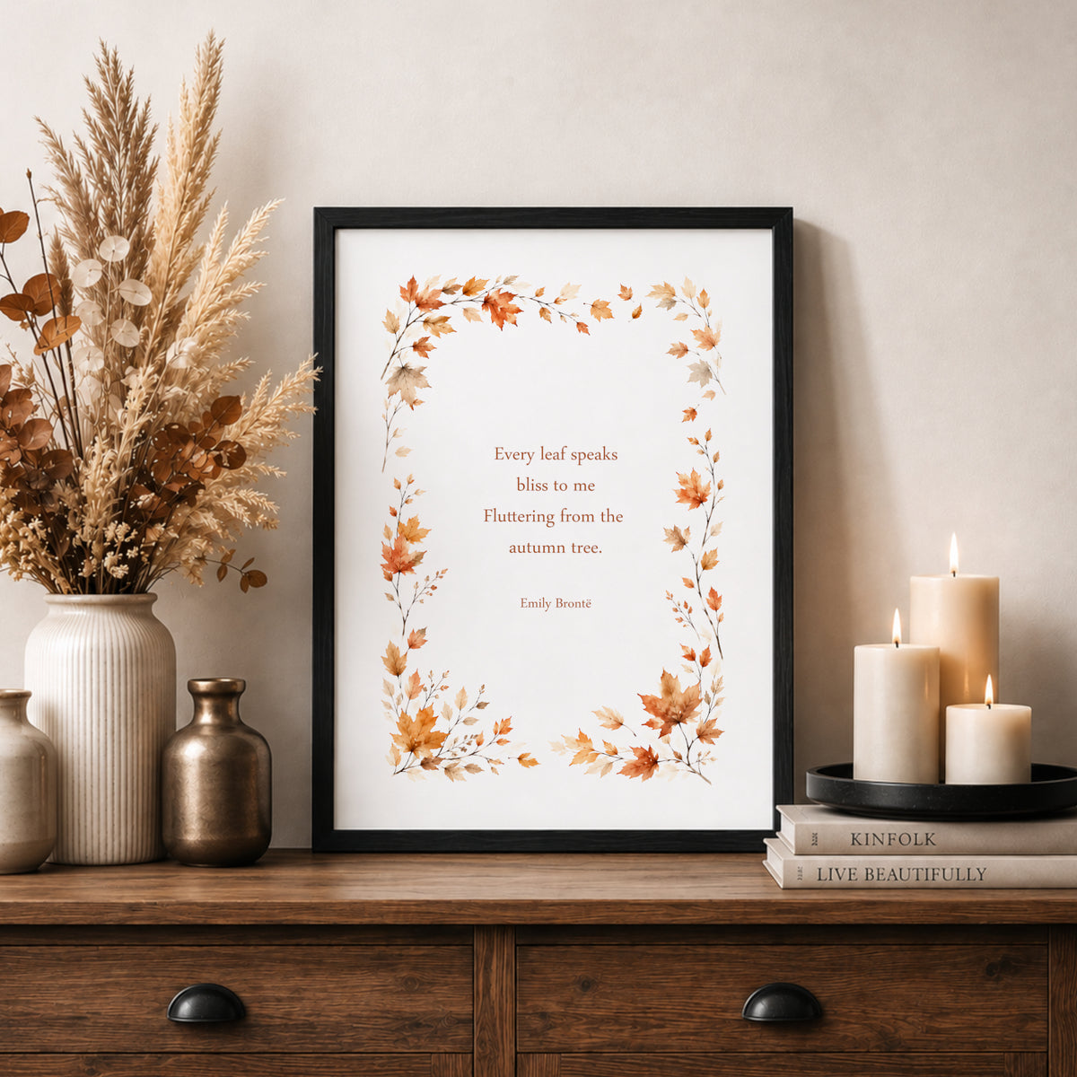 Single portrait print featuring the Emily Brontë’ quote “Every leaf speaks bliss to me, fluttering from the autumn tree.” The text is framed by watercolour-style autumn leaves. Text and illustration in warm autumn tones. Styling is contemporary and elegant. 