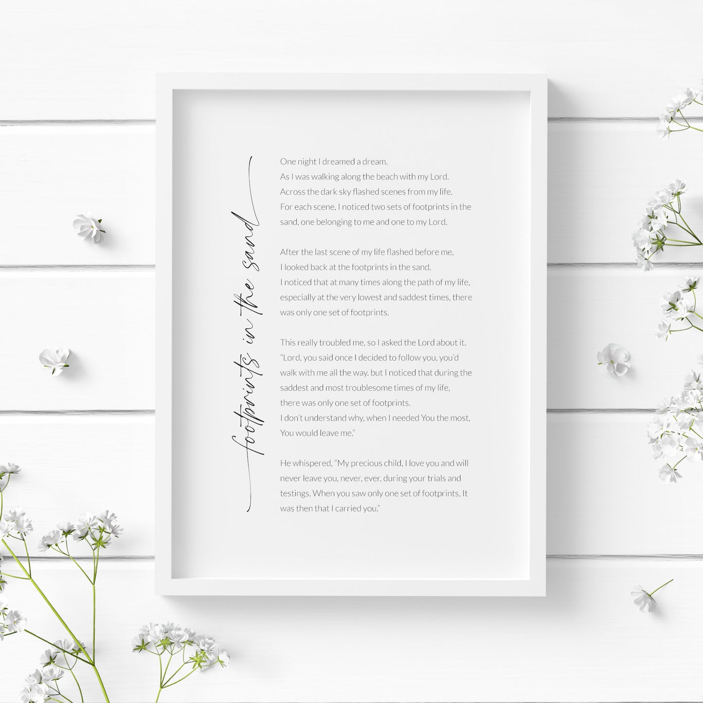Single portrait print of Footprints In The Sand. Title is positioned vertically to the left of the body, and is in a modern script font with trailing edges beginning and end. Body s in a crisp sans serif font. All text is black on a white background.