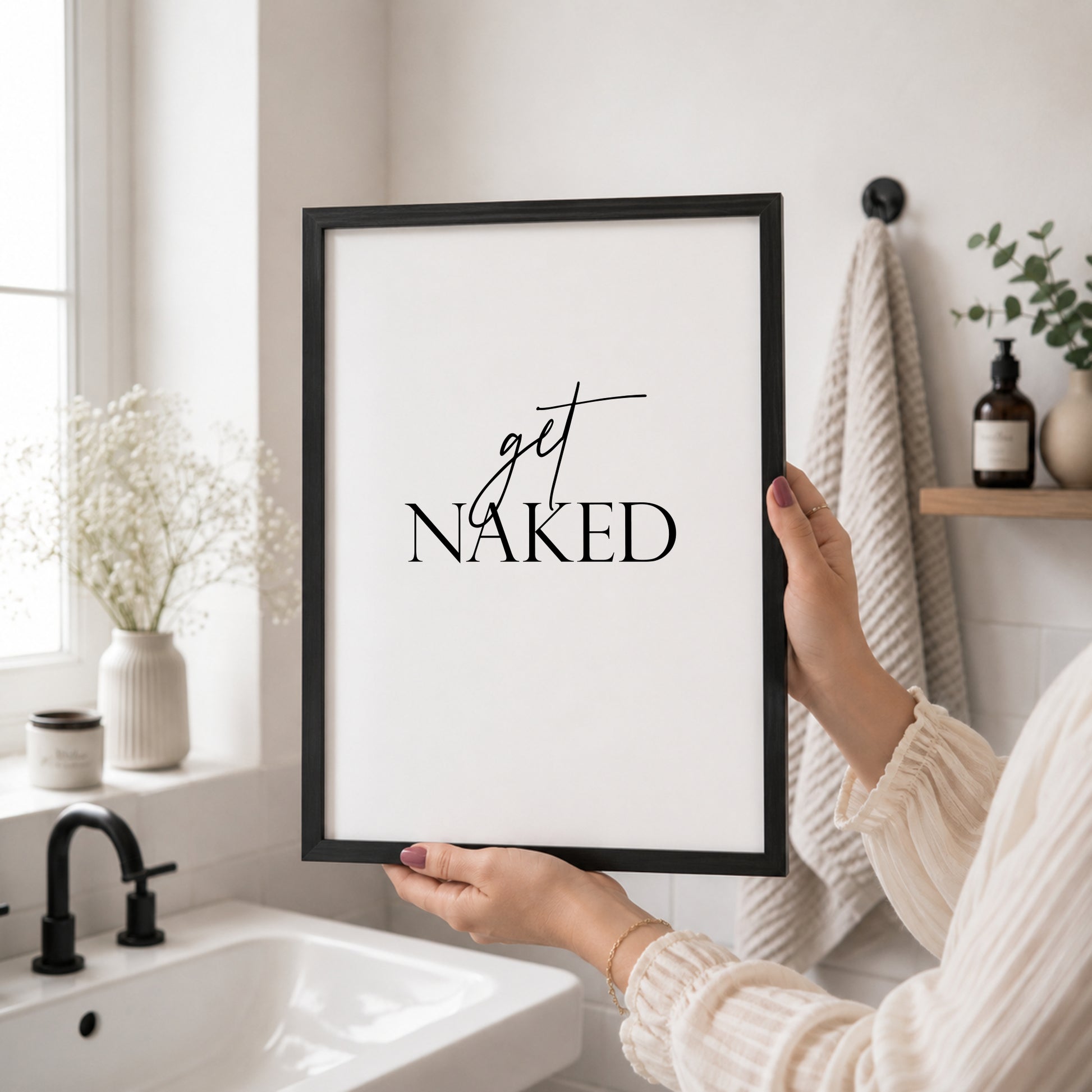 Single portrait typography print. Text reads "get naked". Text is black on a white background and is centre-aligned. Styling is modern and elegant.