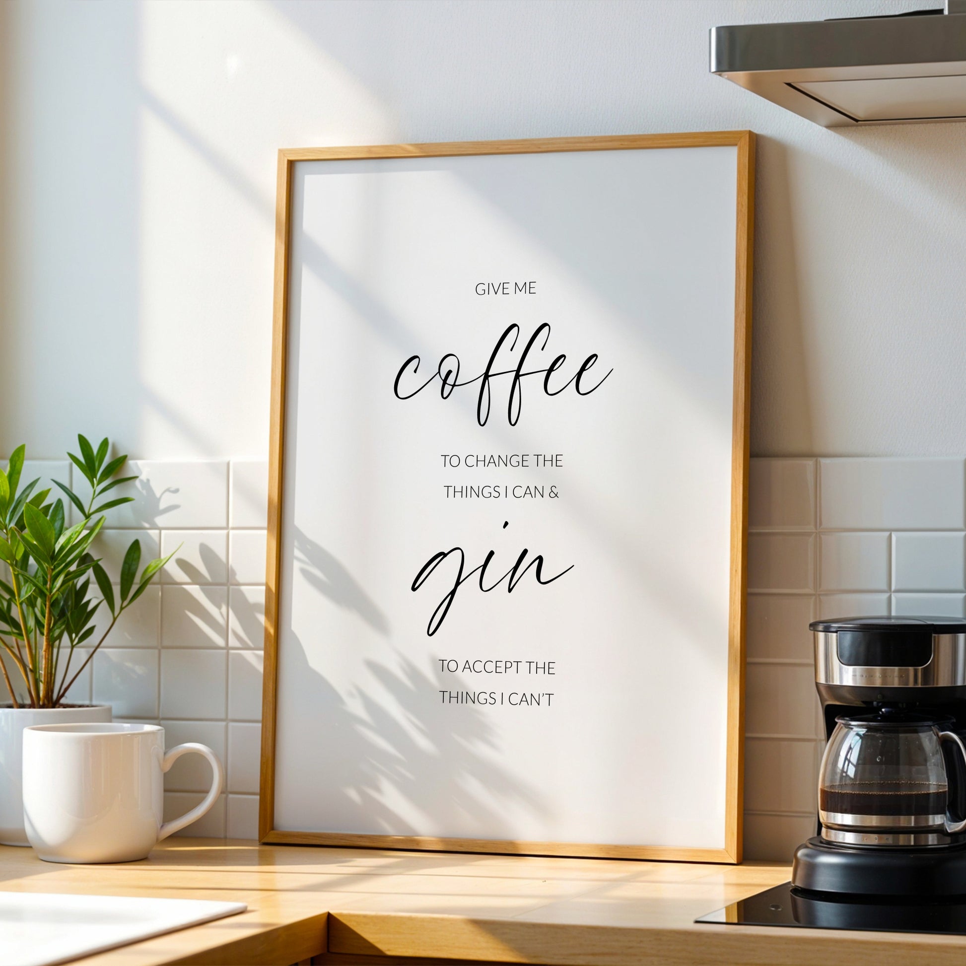 Single portrait typography print. Text reads: Give me coffee to change the things I can & gin to accept the things I can't. The words coffee and gin are positioned prominently in a modern script font, with the remaining text in an upper case lightweight sans serif font.