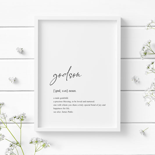 Single portrait typography print showing a dictionary style definition of the word godson. The word godson is in a modern script font, with the remaining text in a lower case serif font. The print is personalised with the name of the godson in a "see also:" section at the end of the definition. Text is black on a white background.