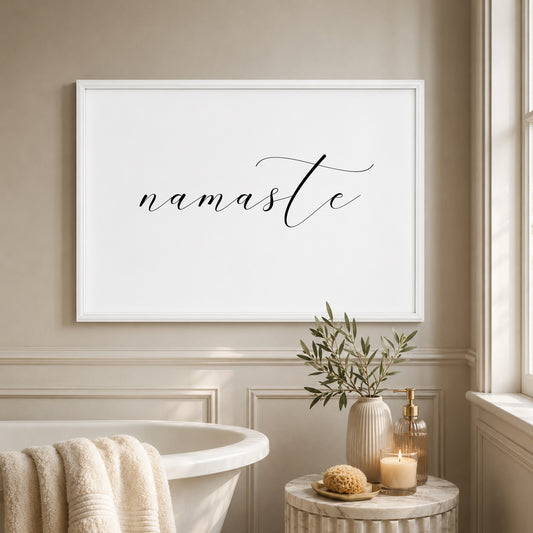 Single landscape typography print featuring the word namaste. An elegant script font is used and the word is all in lower case. Text is black on white background.