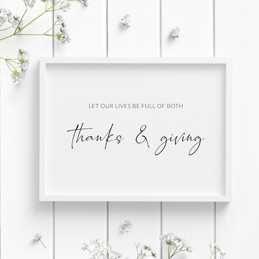 Single landscape typography print. Black text on a white background reads: Let our lives be full of both thanks & giving. The words thanks & giving are prominent and in a modern script font. Other text is in a small upper case sans serif font.