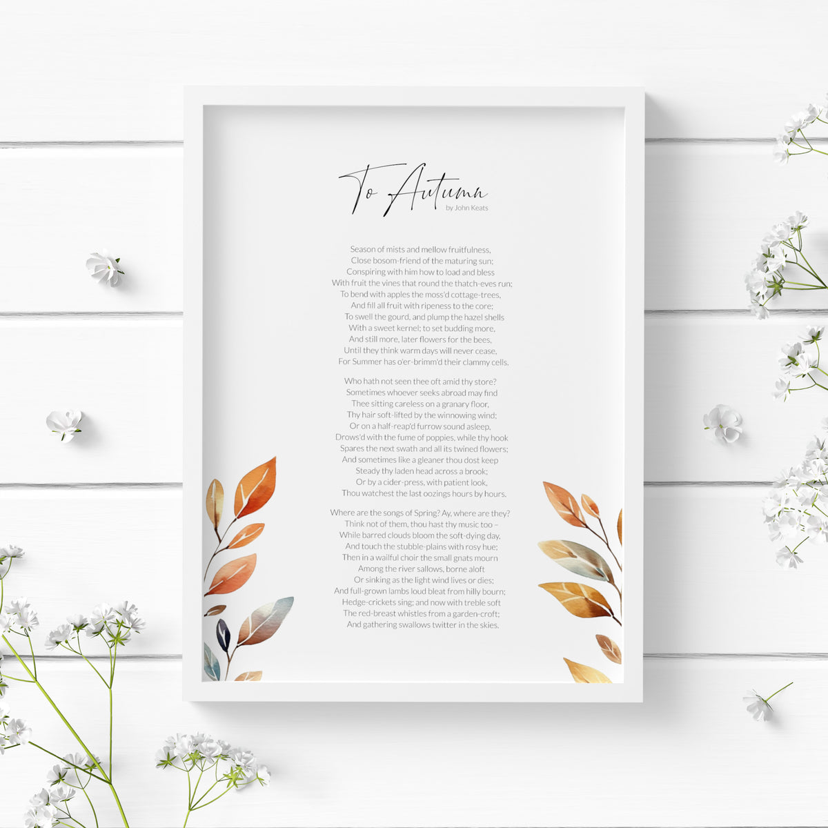 Single portrait print featuring the poem To Autumn by John Keats. The title is in a modern script font with the body text is a lightweight sans serif font. All text is black on a white background and centre-aligned. The print is embellished with a watercolour illustration of autumn leaves, which frame the poem to the bottom left and right. Styling is modern and elegant.