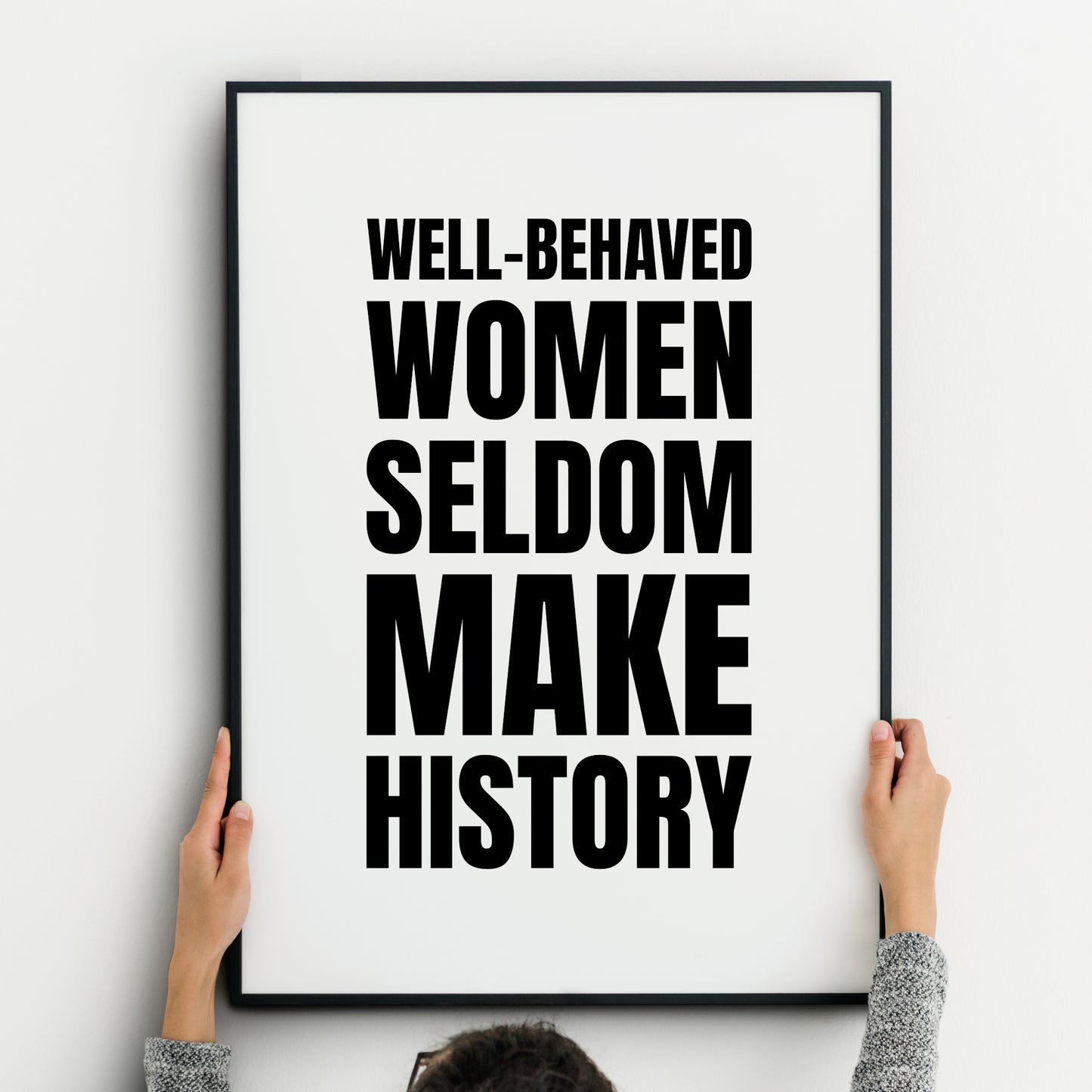 Single portrait typography print. Text reads: Well-behaved women seldom make history. Text is in a bold upper case sans serif font, black on a white background. Text is centred horizontally and vertically, with text size adjusted for each word so that the quote is fully justified. Styling is strong and modern.