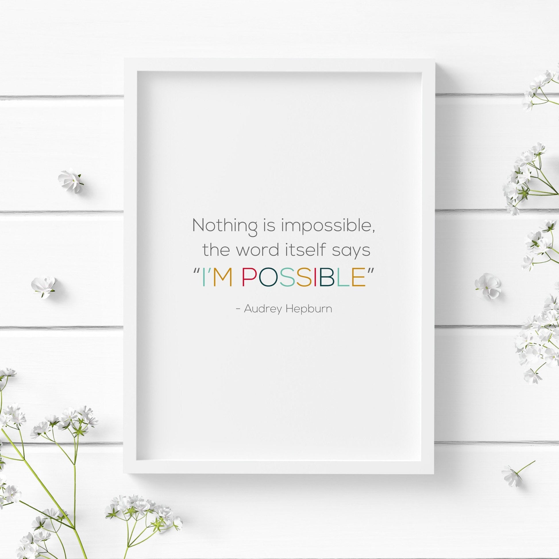 Single portrait typography print. Text reads: Nothing is impossible. The word itself says "I'm possible". This is followed by an attribution to Audrey Hepburn. "I'm possible" is highlighted in multicolour.