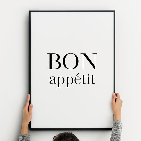 Single portrait typography print for the kitchen or dining room. Text reads: Bon appetit. The words are stacked vertically, with Bon in upper case and appetit in lower case. The formal serif font has been sized so both words have the same width.