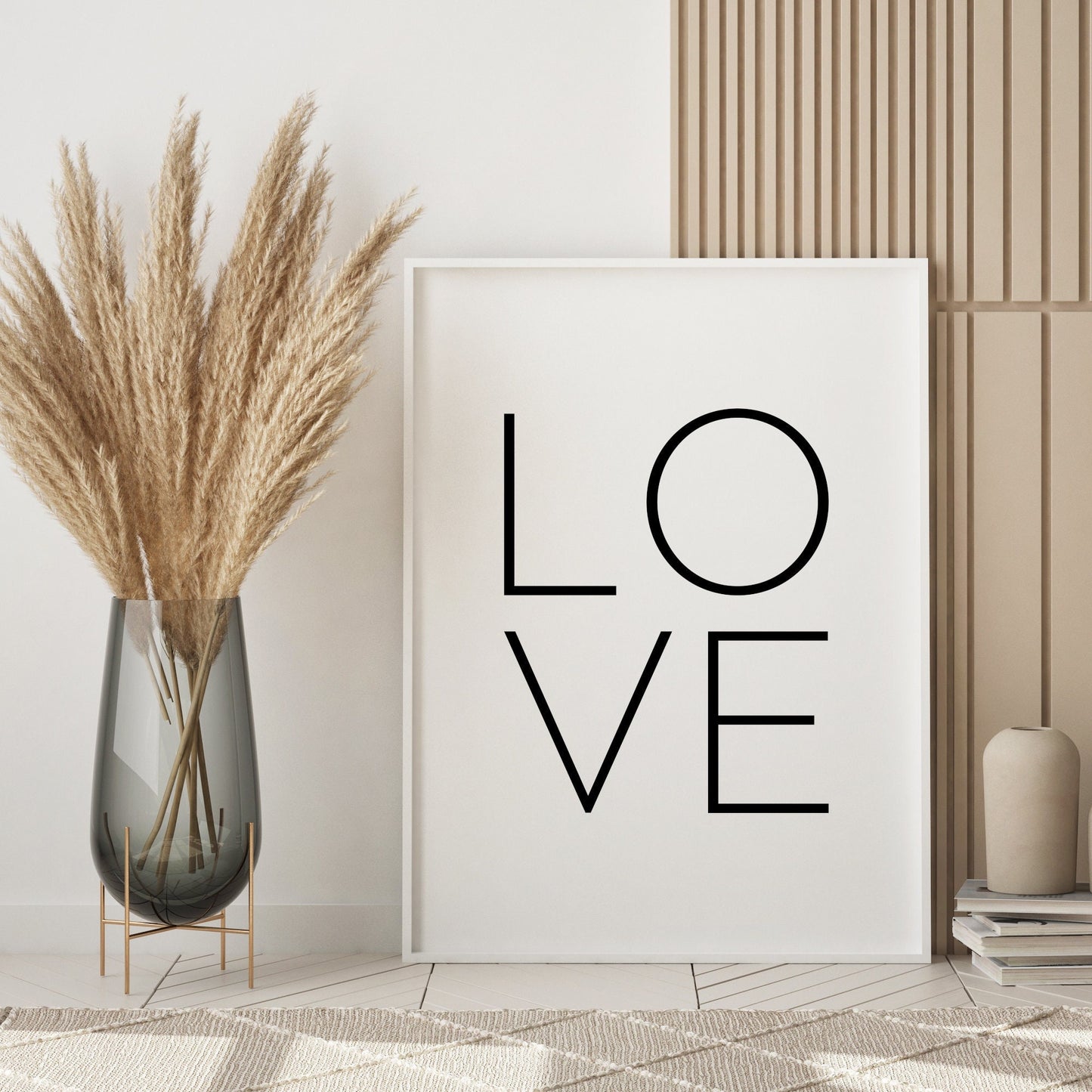 Single portrait typography print featuring the word love. All text is in a large upper case sans serif font, with two letters on each row. Text is black on a white background.